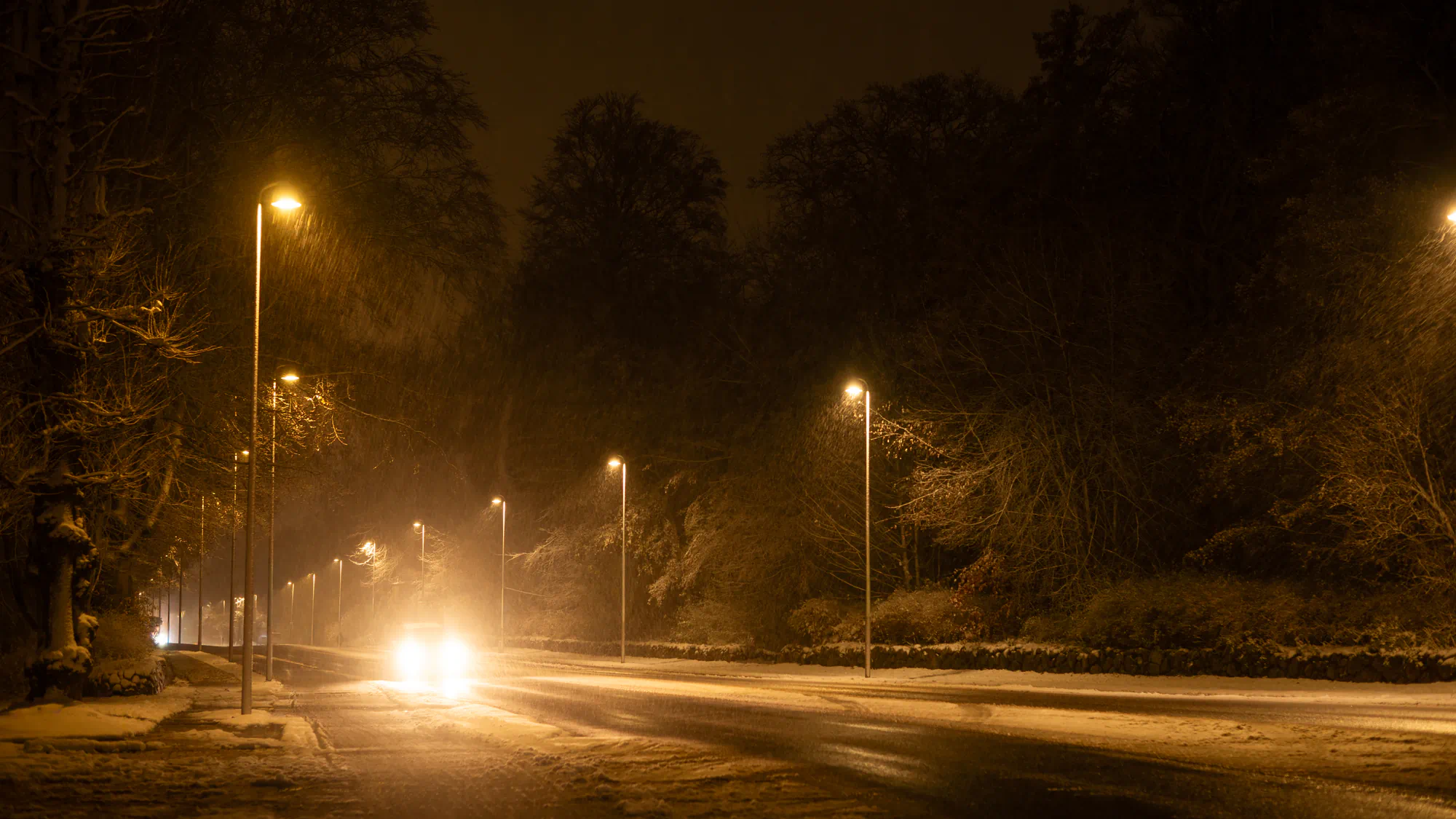 snowy street at night